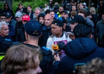 Water cannon and roadblocks deployed as asylum riots continue