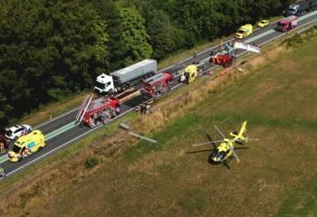 One person dies, six injured in crash between lorry and minibus