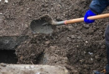 Two men suspected of helping grave robber sell stolen valuables