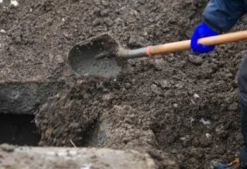 Two men suspected of helping grave robber sell stolen valuables