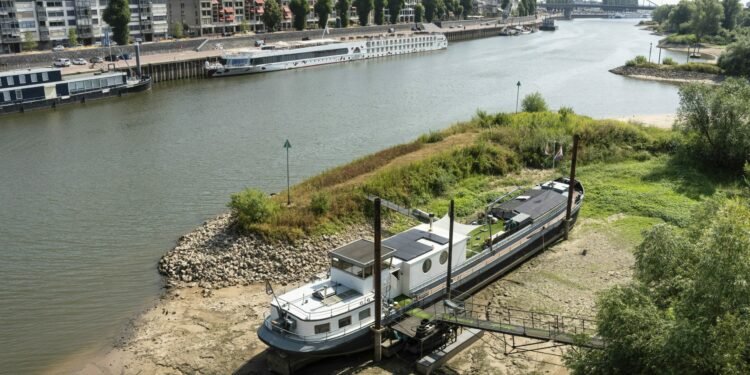 Dutch houseboat owners left high and dry by falling river levels