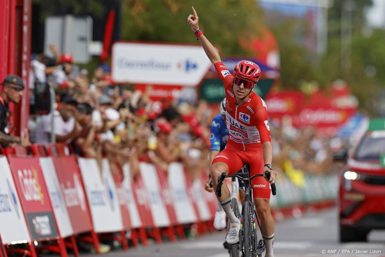 epa13194742 Slovenian rider Tadej Pogacar of team UAE Team Emirates XRG celebrates winning the 6th stage of the La Vuelta a Espana cycling tour, a race over 177.4km from Alcossebre to Castellon, Spain, 27 August 2026.  EPA/Javier Lizon