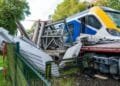 Passengers evacuated after train hits lorry on level crossing